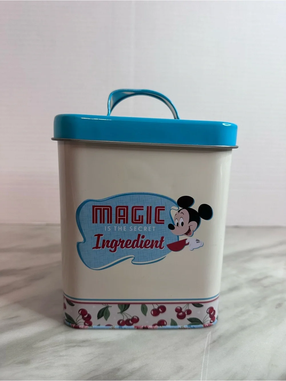 Disney White Tin with Teal Lid and Cherry Accent